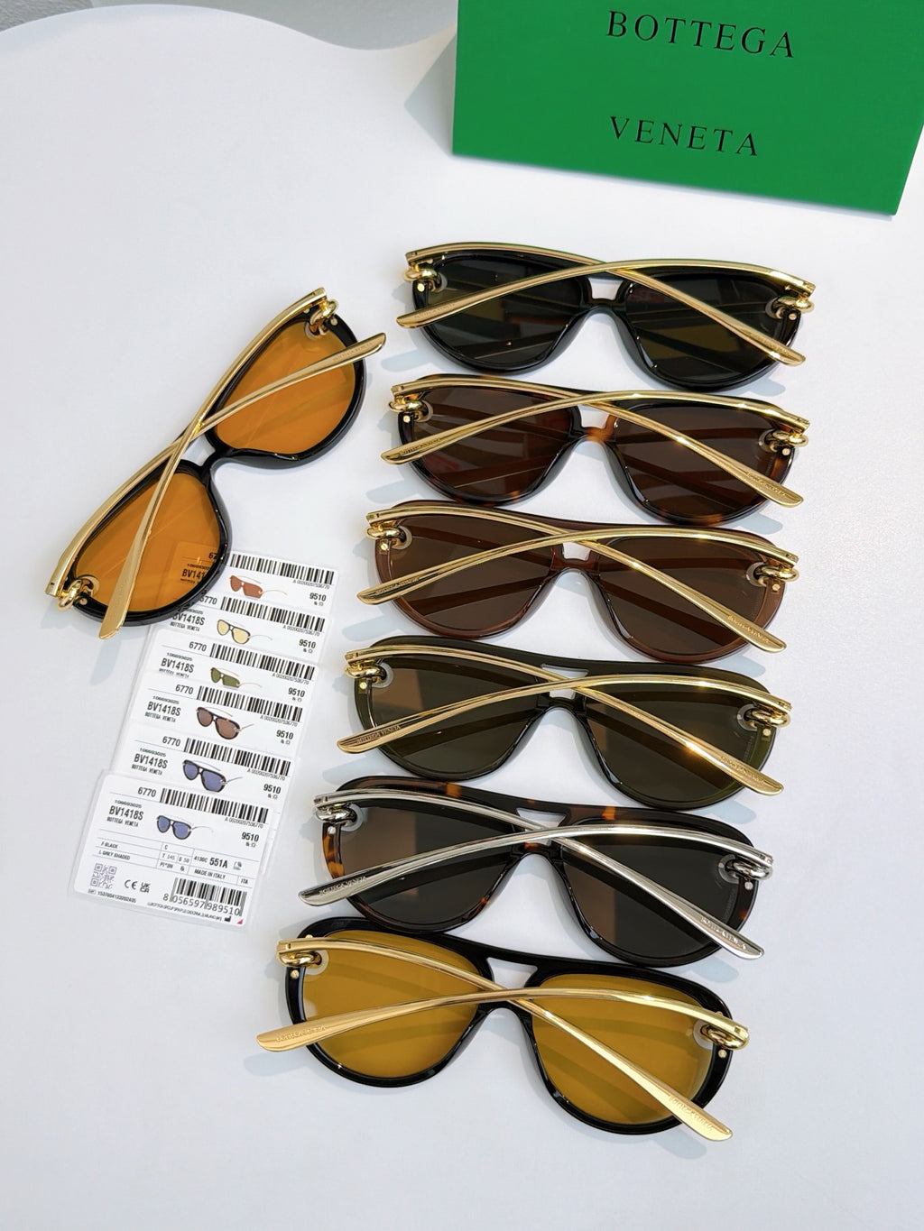 Assorted sunglasses set with gold-tone frames and tinted lenses, includes one with dark lenses.
