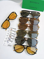 Assorted sunglasses set with mixed frames and gold-tone accents, tinted lenses on multiple pairs.