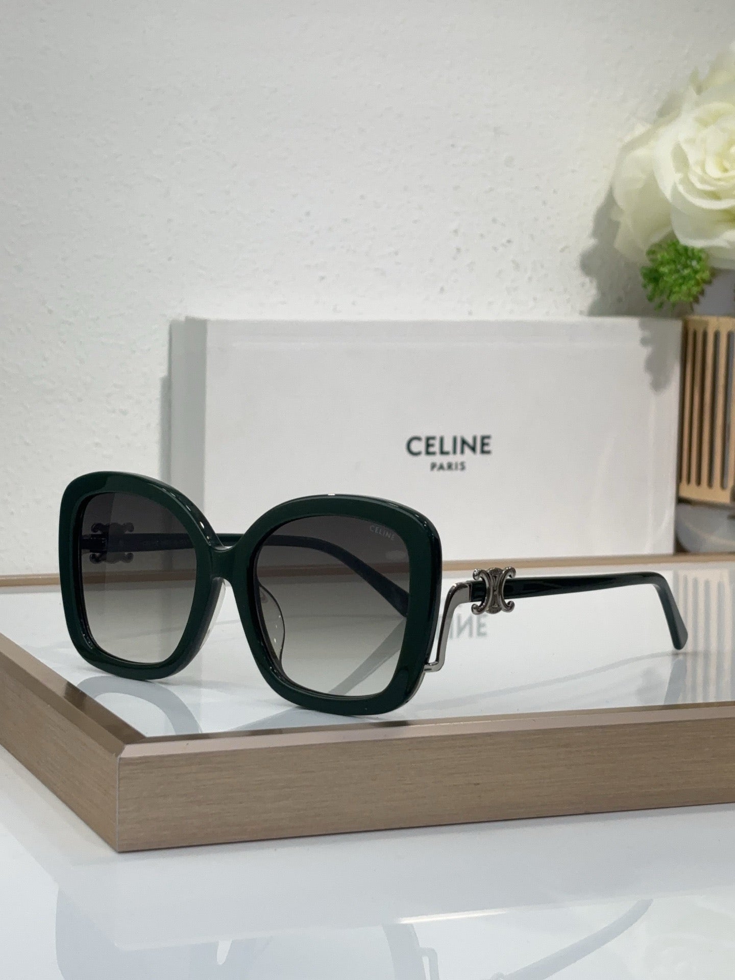 Celine dark green square sunglasses with dark tinted lenses and gold-toned accents