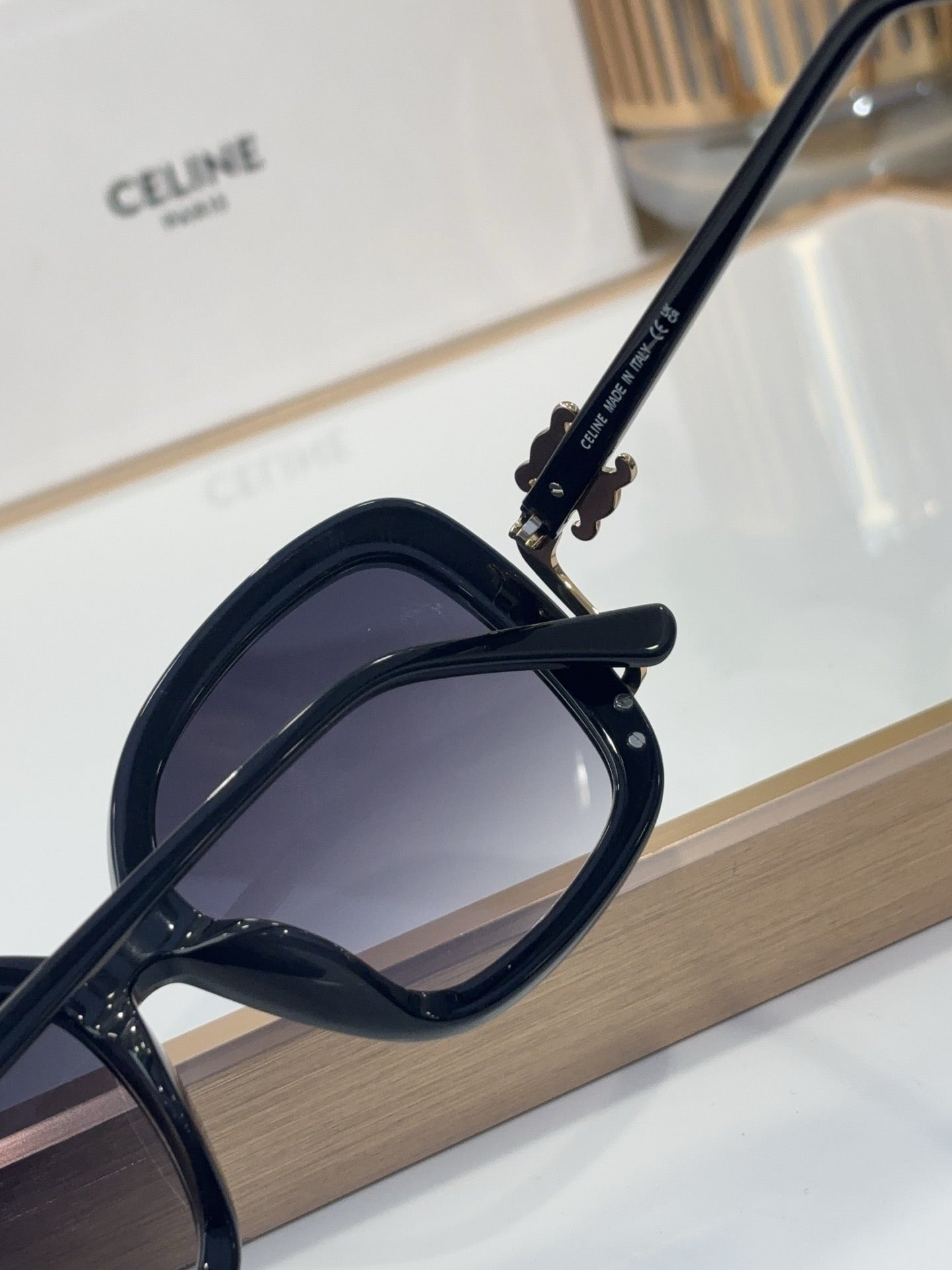 Celine black sunglasses with engraved temple logo and dark tinted lenses