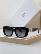 Celine sunglasses with black frame and dark tinted lenses