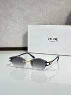 Metal-framed sunglasses with dark gray lenses and black temple tips