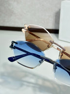 Metal-framed sunglasses with blue lenses and clear top bar