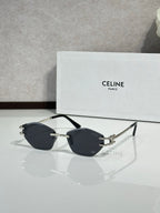Metal-framed sunglasses with dark lenses and gold-tone bridge hardware