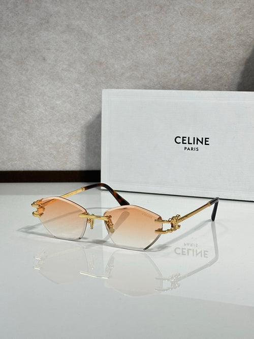 Metal-framed sunglasses with amber gradient lenses and gold-tone temples