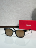 Prada sunglasses with black frame and brown-tinted lenses