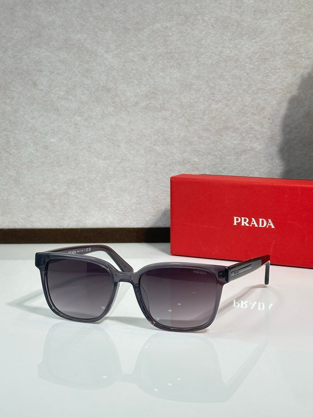 Prada sunglasses with dark frame and tinted lenses