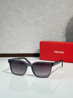 Prada sunglasses with dark frame and tinted lenses