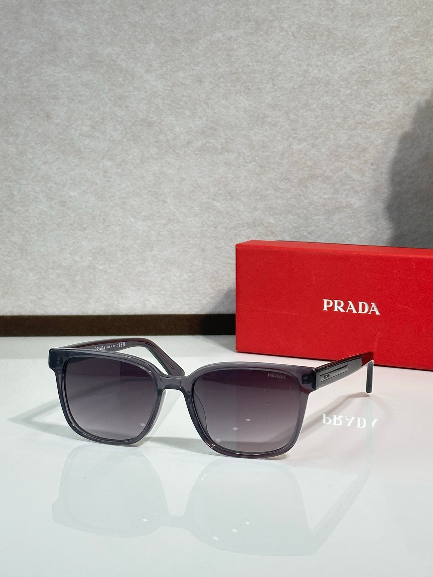 Prada sunglasses with dark frame and tinted lenses