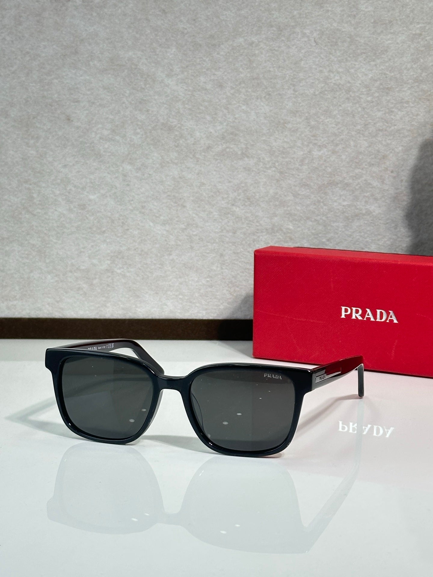 Prada sunglasses with black frame and dark smoke lenses