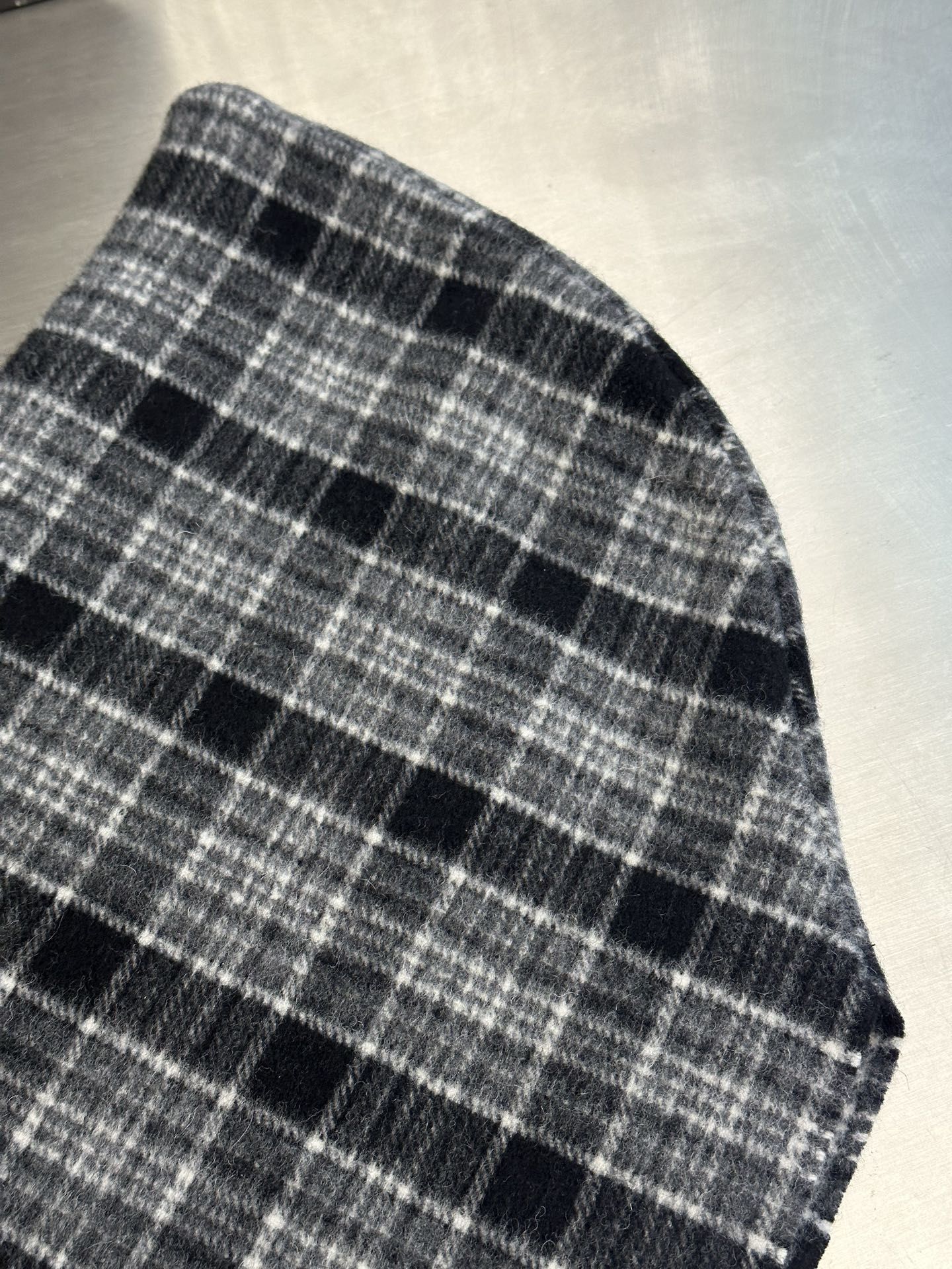 Plaid poncho fabric panel with dark and light grid pattern