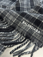 Balenciaga logo printed on plaid poncho fabric with fringe