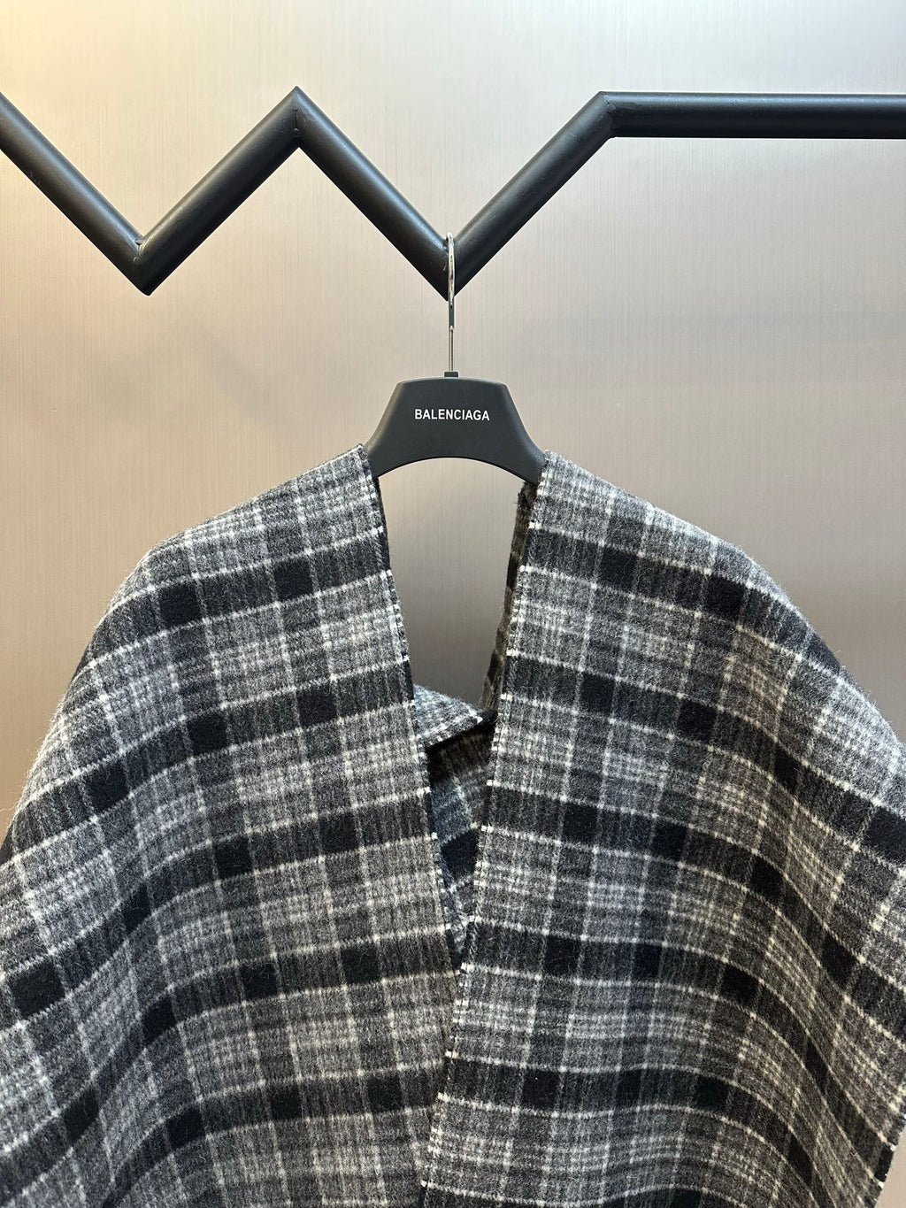 Balenciaga plaid poncho with V neckline and buttoned placket, fringe edge