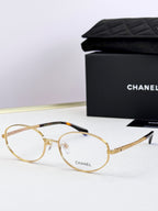 Chanel eyeglasses with gold round frames and clear lenses