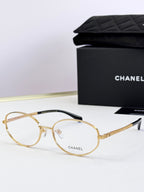 Chanel eyeglasses with gold round frames and clear lenses