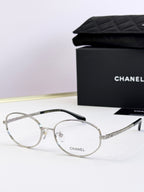 Chanel eyeglasses with silver round frames and clear lenses