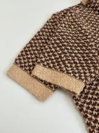 Knit polo shirt hem and cuff detail with tan rib trim and brown patterned knit