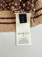 Knitted polo shirt care label showing 'Made in Italy' and care icons