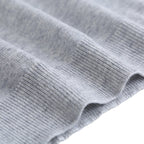 Light gray ribbed sleeve cuff close-up.