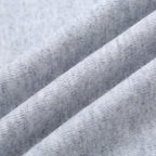 Light gray sweatshirt fabric texture close-up.