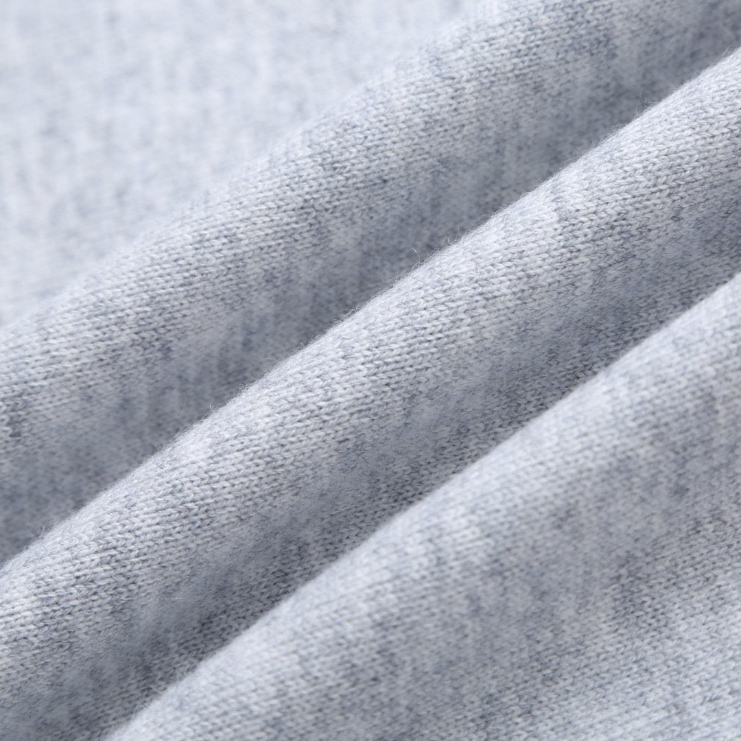 Light gray sweatshirt fabric texture close-up.