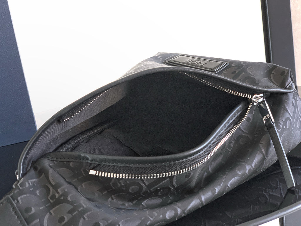 Dior monogram bag interior view with zippered pocket and dark lining