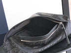 Dior monogram bag interior view with zippered pocket and dark lining
