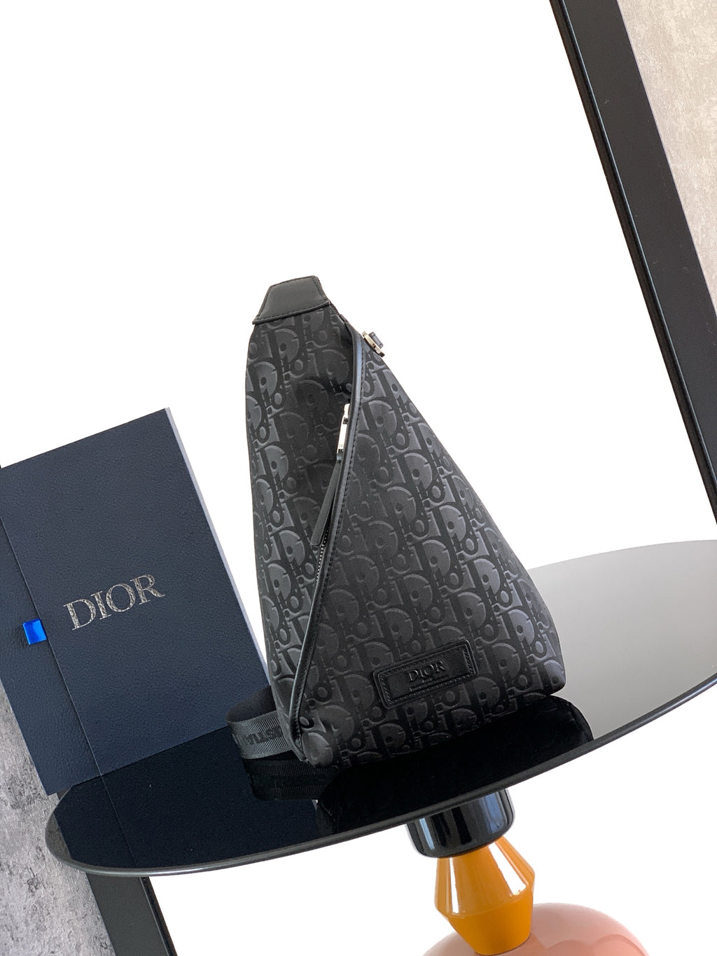Dior monogram crossbody bag with top zip and adjustable shoulder strap