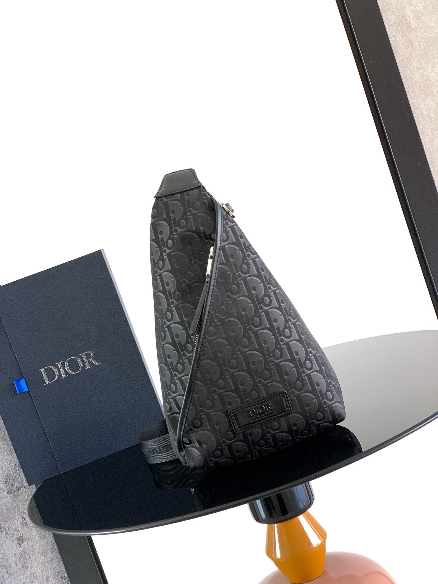 Dior monogram crossbody bag with top zip and adjustable shoulder strap