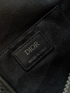 Dior bag brand label patch on textured fabric