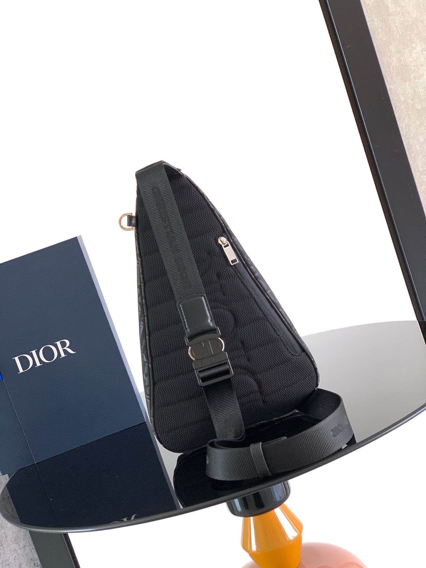 Dior monogram crossbody bag with front strap detail and buckle hardware