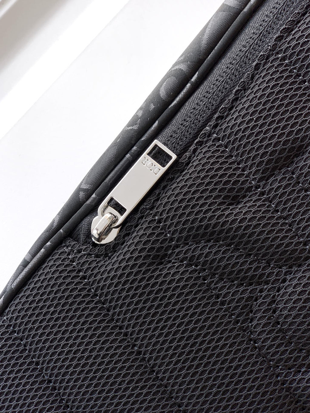 Dior bag corner buckle strap with metal D-ring and stitched trim