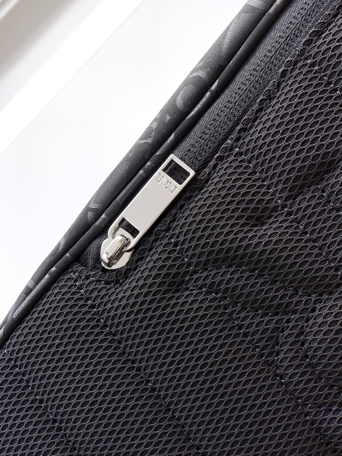 Dior bag corner buckle strap with metal D-ring and stitched trim