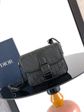 Dior bag with dark Dior Oblique canvas, front flap, and black buckle closure