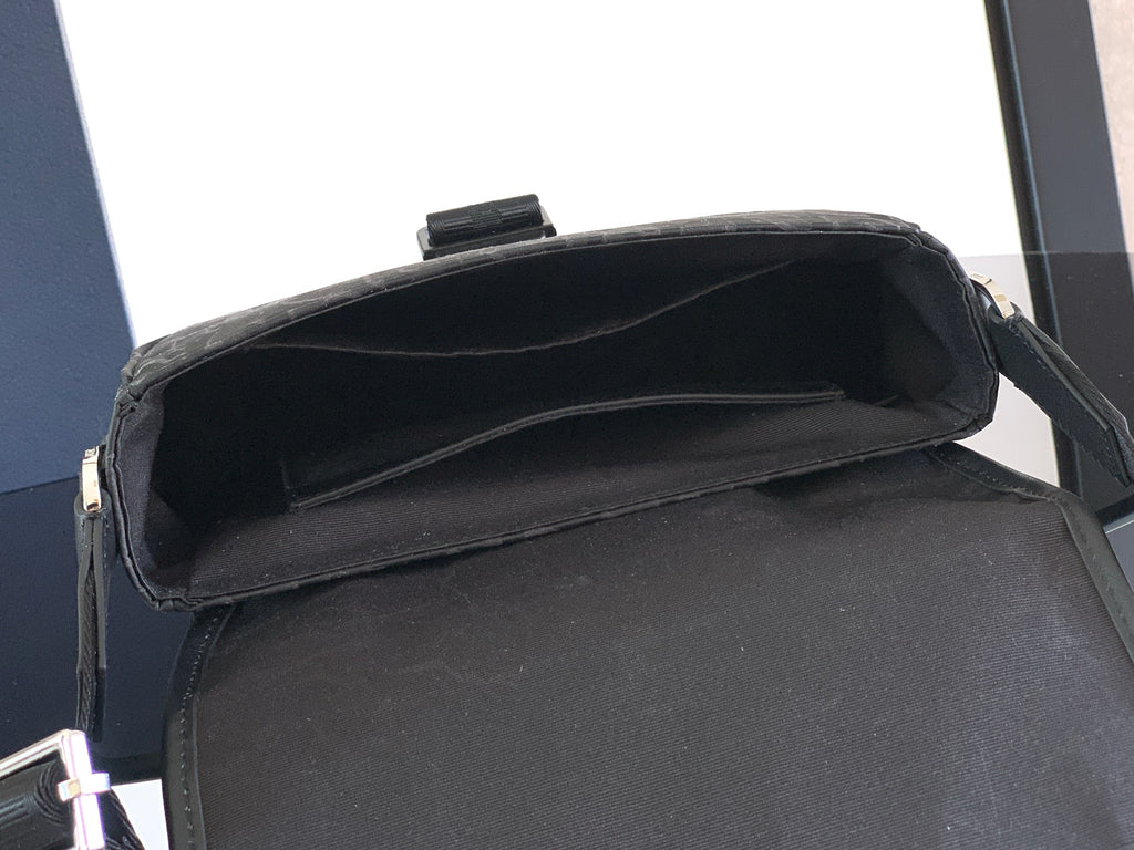 Dior bag with open top and smooth black interior lining