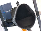 Dior black monogram bucket-style bag with open top and black fabric lining