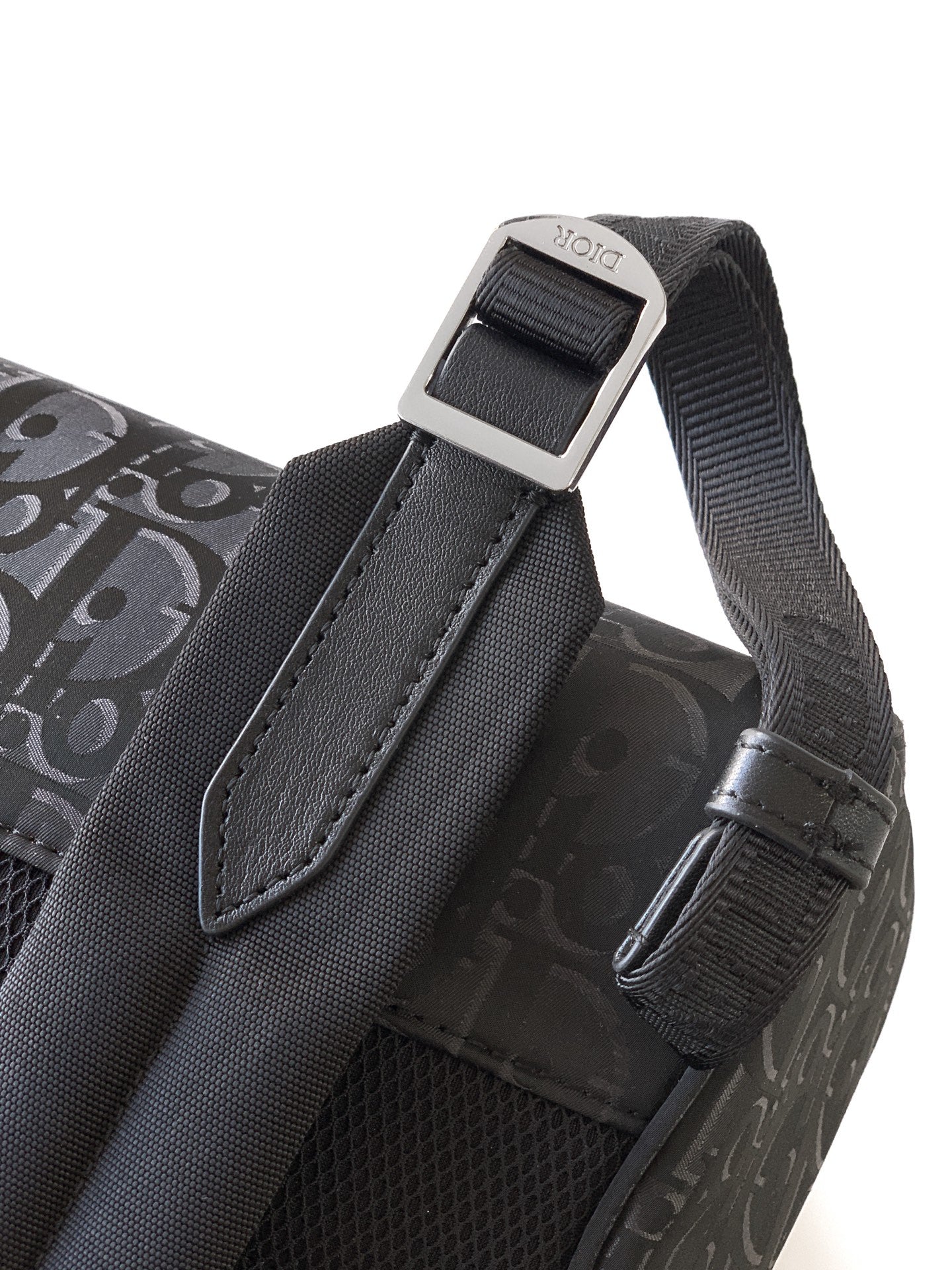 Dior monogram bag strap end with metal adjuster and stitched trim