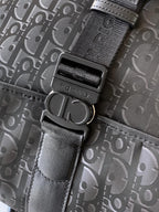 Dior monogram bag hardware: textured strap with black buckle and D-ring
