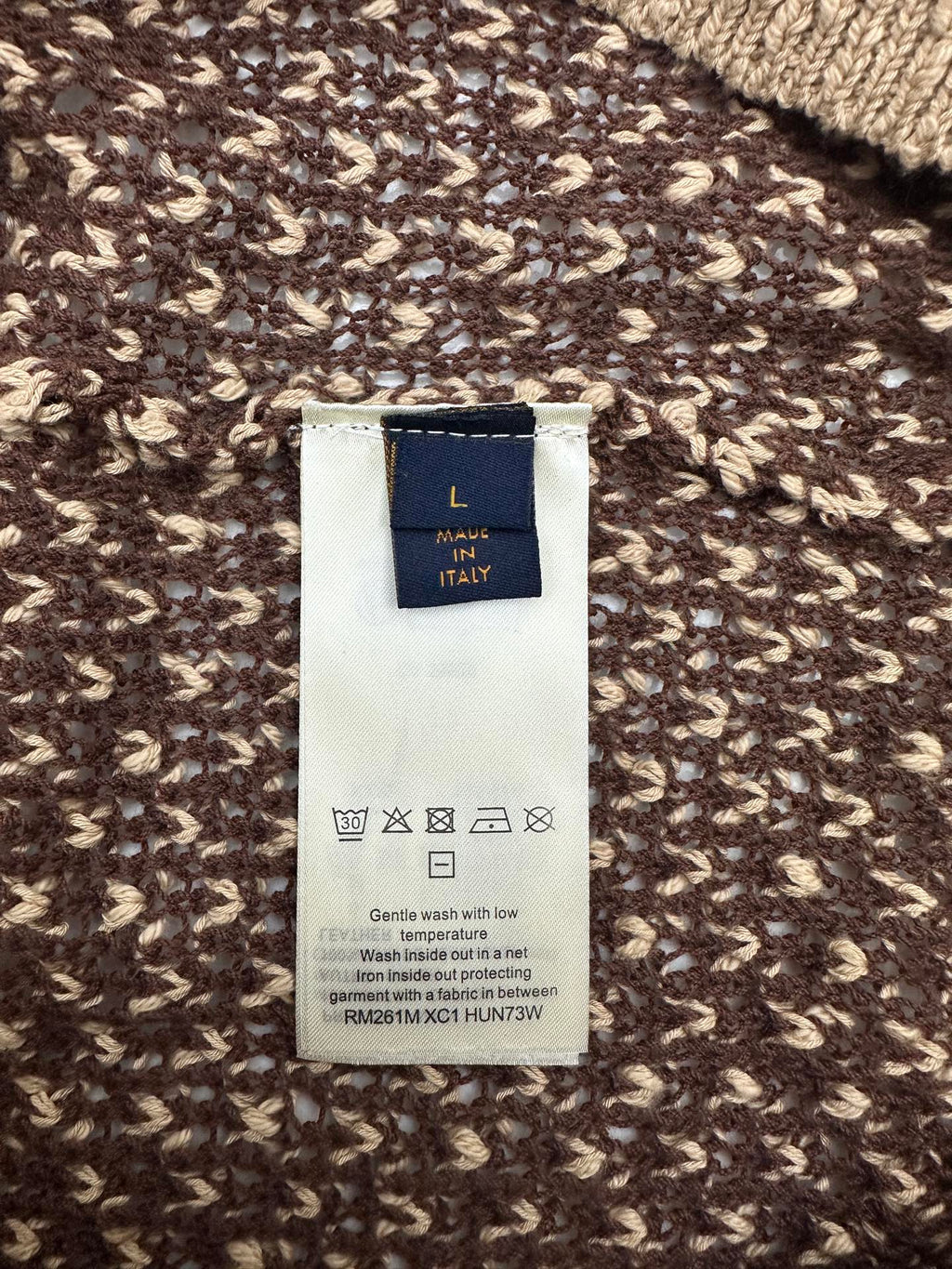 Louis Vuitton garment label on knit polo fabric, 'MADE IN ITALY' tag