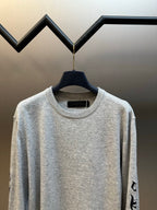 Light gray heather crewneck sweatshirt with ribbed collar and black side sleeve print