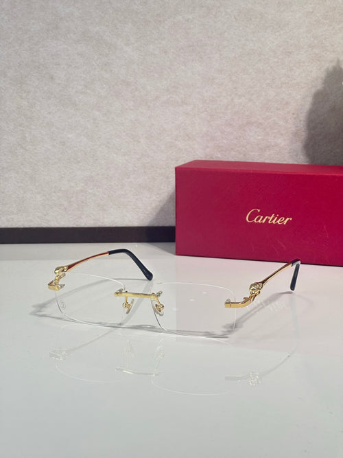 Cartier eyeglasses with clear lenses, dark frame and gold-tone hinges, front view.