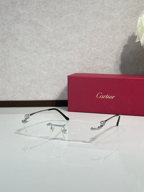 Cartier eyeglasses with clear lenses and dark frame, gold-tone detail, side view.
