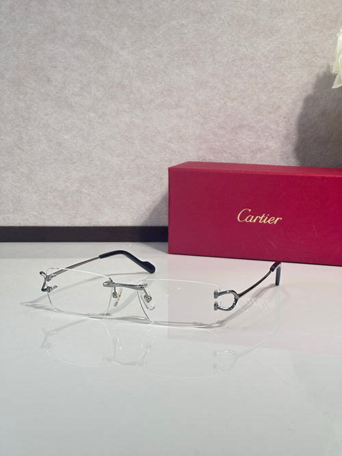 Cartier eyeglasses with silver-tone metal rims, blue temple tips, clear lenses