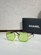 Chanel glasses with neon green frames and green-tinted lenses
