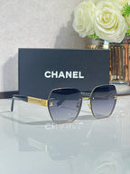 Chanel glasses with navy frames and blue-tinted lenses