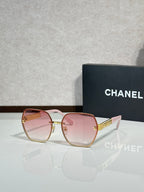 Chanel glasses with pale pink frames and pink-tinted lenses