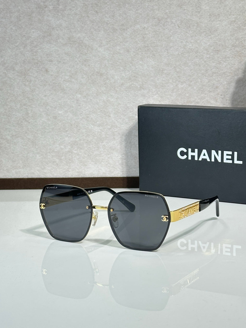Chanel glasses with dark gray frames and smoky gray lenses