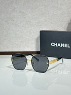 Chanel glasses with dark gray frames and smoky gray lenses