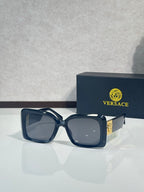 Square Versace sunglasses, dark blue frame with gray tinted lenses.