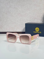 Square Versace sunglasses, light pink frame with rose-tinted lenses.